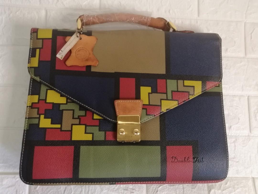 Double Fish Japan Document Handbag (Category: Luxury Bags & Wallets) located in Las Pinas. Submitted by etoksi1234 (Listing ID 1109921304, Image 1). Description: Brandnew Double Fish Document Handbag... Na stock lang kaya nagka crackings sa lining sa loob... Intack pa yung plastic sa handle nya... Medium size with gold hardware....