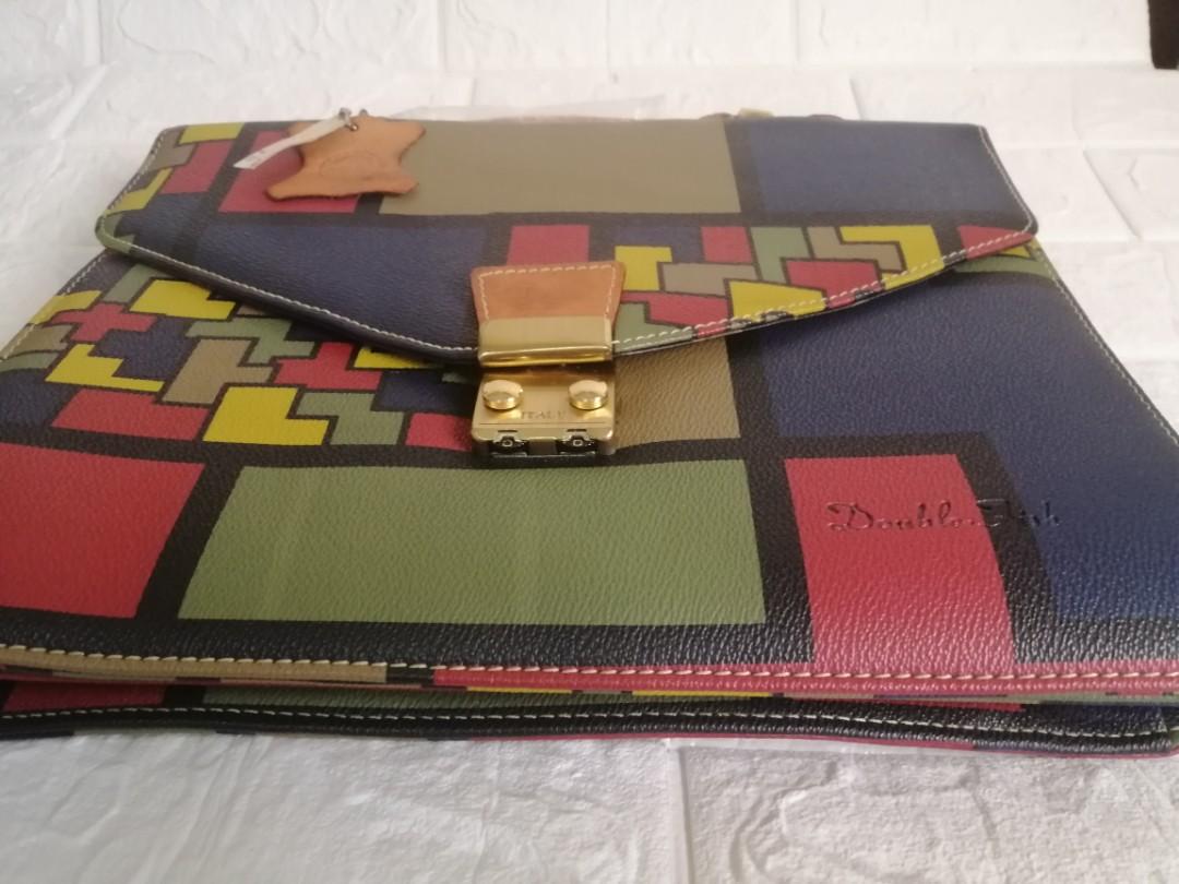 Double Fish Japan Document Handbag (Category: Luxury Bags & Wallets) located in Las Pinas. Submitted by etoksi1234 (Listing ID 1109921304, Image 3). Description: Brandnew Double Fish Document Handbag... Na stock lang kaya nagka crackings sa lining sa loob... Intack pa yung plastic sa handle nya... Medium size with gold hardware....