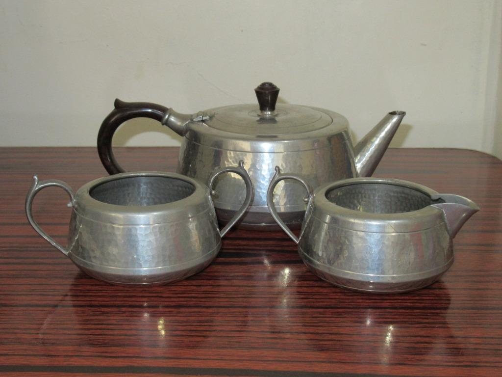 Vintage Pewter Teapot set from England (Category: Other Home Decor) located in Mangaldan. Submitted by thriflip_online_shop (Listing ID 1109877059, Image 1). Description: Vintage knighthood old English hand-hammered pewter tea set teapot sugar bowl and milk jug. The handle is made of bakelite. There are scratches and dents, especially on the teapot. All aspects of the item were captured in photos. Please view images carefully to determine the con