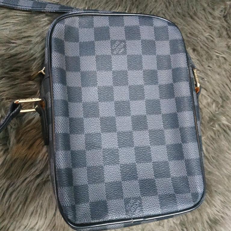 LV Graphite Sling Crossbody Bag (Category: Luxury Bags & Wallets) located in Manila. Submitted by shopaholic_gurl (Listing ID 1109924690, Image 2). Description: Preloved sling bag with leather flaw some leather cracks as per pics posted Sold as is Payment first prior to shipment MOP: GCASH, PAYMAYA, BDO, Palawan.
