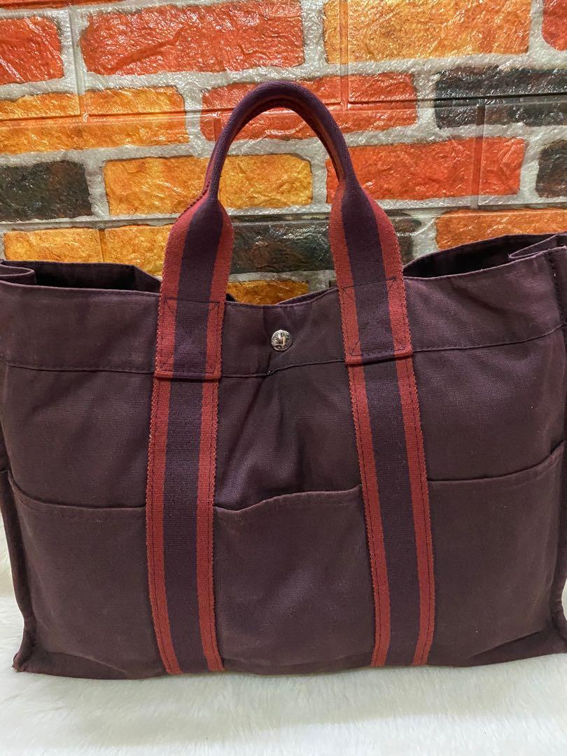Authentic Hermès Canvas Tote Bag (Category: Luxury Bags & Wallets) located in Cagayan de Oro. Submitted by riggstuffs (Listing ID 1110393985, Image 1). Description: Preloved bag from Japan and guaranteed 💯 authentic Made in France Canvas material in Maroon and black color combination The exterior part is good except for some visible rubs at 2 corners of the bag Interior is good Riri zipper Rank AB in condition DISCLAIMER: Riggstuffs is not affil