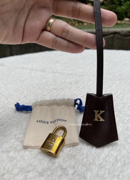 Louis Vuitton Clochette key bell with lock&key, Women's Fashion, Bags &  Wallets, Tote Bags on Carousell