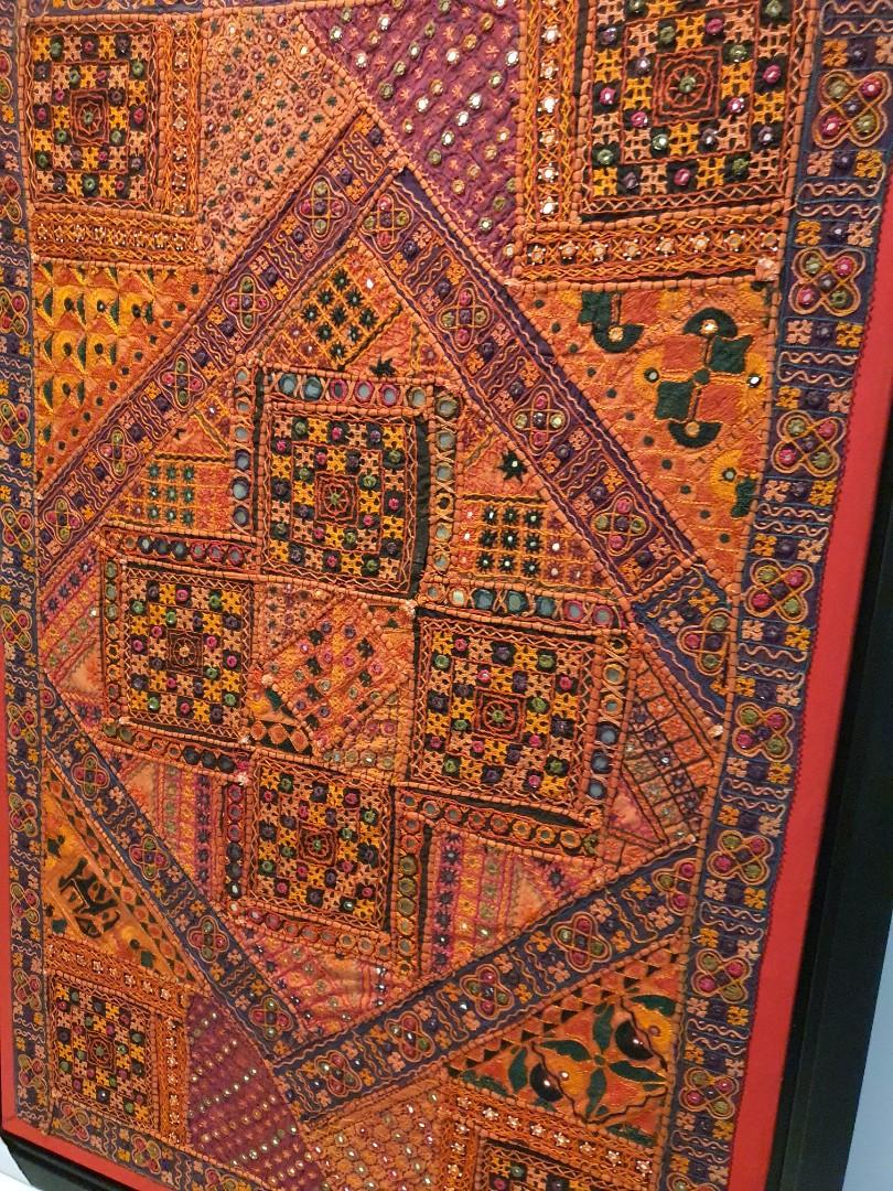 Fabric Decor (Category: Wall Decor) located in Singapore. Submitted by wilderness (Listing ID 1104922607, Image 2). Description: Letting go of this unique piece - the fabric was purchased at a shop in Holland V many years back. It cost us an arm and a leg but we loved it for the color and details. The red border was lovingly handstitched on. The frame was later added during our time overseas but we have not displayed it since we moved a number of