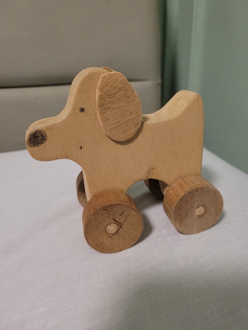 Wooden dog on wheels shop