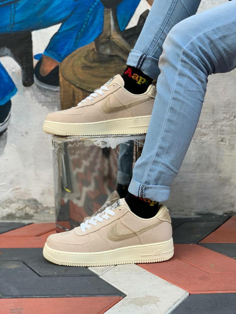 nike stussy fossil on feet