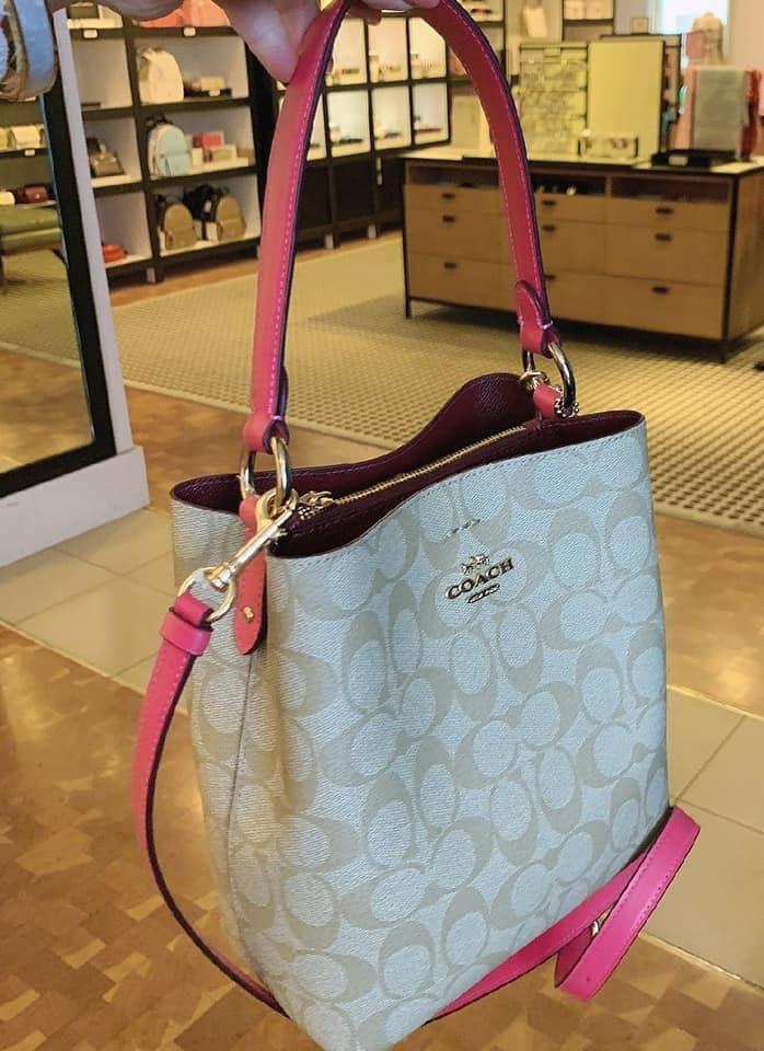 Pink coach bucket best sale bag