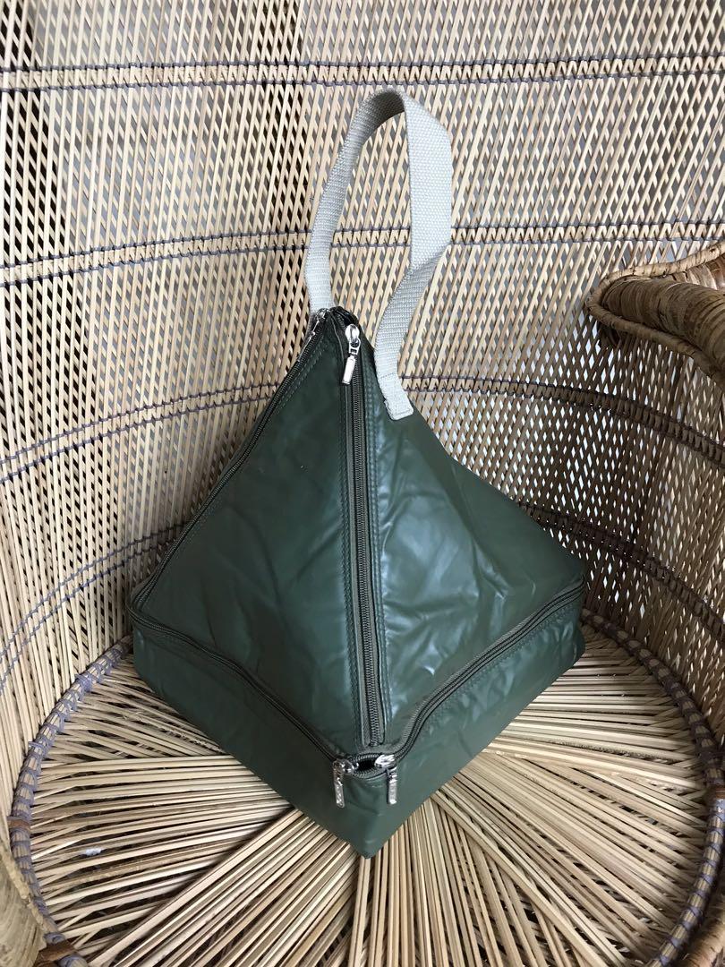SALE: Foldable Triangle Bag (Category: Tote Bags) located in Bulacan. Submitted by orange.locker (Listing ID 1104999963, Image 1). Description: Triangle Bag Zipper works/ ykk Hardboard base canvas handle Very nice Unique design Foldable Spacious 11 inches base length 12 inches height.