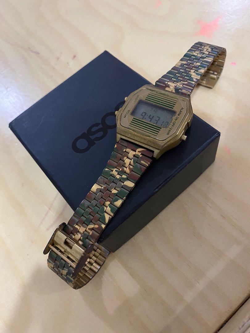 ASOS Retro Watch in Green Camo (Category: Men's Watches) located in Quezon City. Submitted by martinhatol (Listing ID 1105255202, Image 2). Description: Discontinued style. ASOS Retro Watch in Green Camouflage. Like new. Barely used. Complete with box and booklet. Easy adjustable strap. .