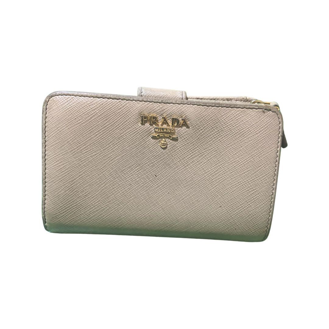 Project Wallet - Prada Saffiano Bifold Wallet (Category: Luxury Bags & Wallets) located in Quezon City. Submitted by najamazing (Listing ID 1105135848, Image 1). Description: Please see attached photos for flaws Inclusion: Authenticity Card Rank: BC.