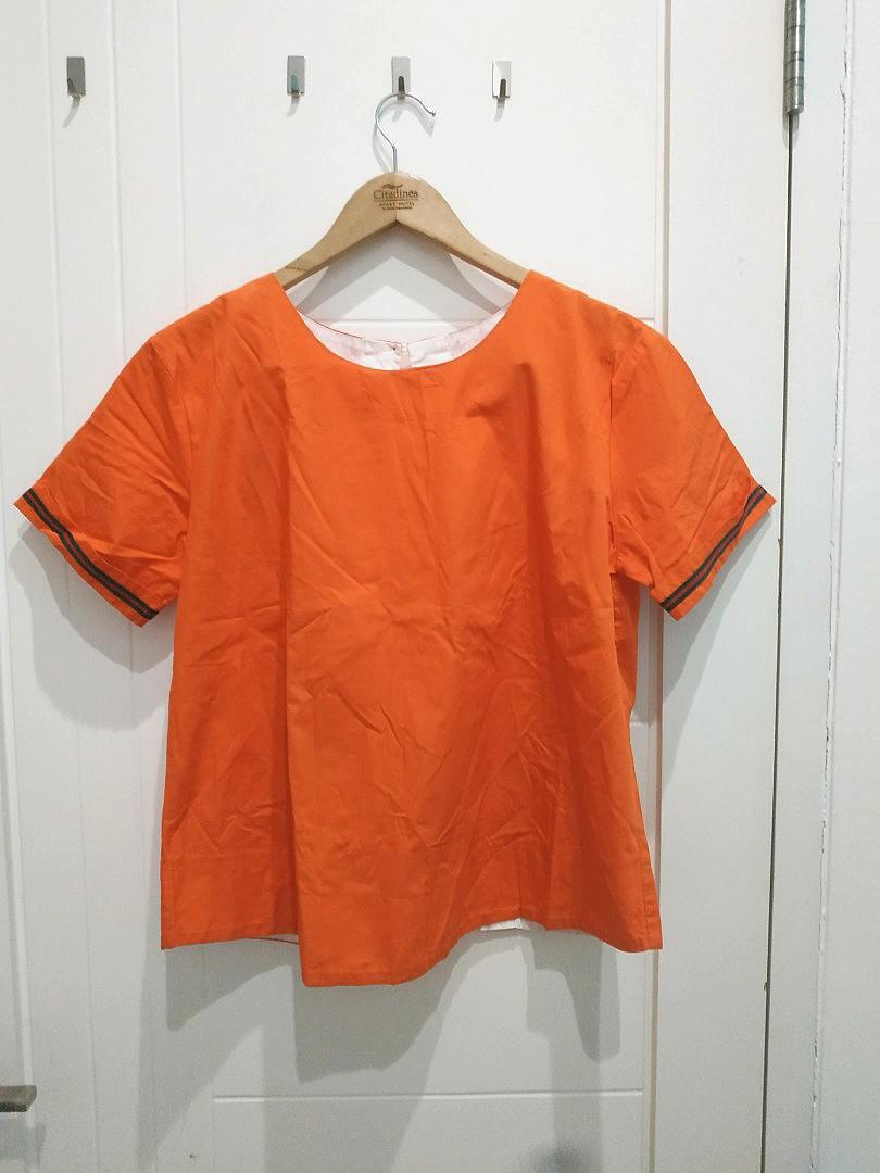 white and orange blouse