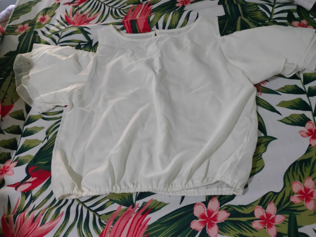 Off-shoulder white blouse (Category: Blouses) located in Quezon City. Submitted by _apparels_ (Listing ID 1105672182, Image 2). Description: Plain white off-shoulder Used only once.