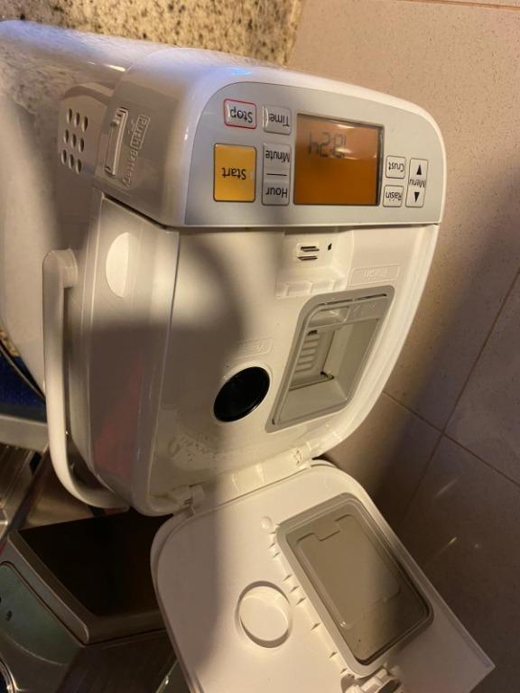 Panasonic bread maker (Category: Breadmakers) located in Singapore. Submitted by tanmayb (Listing ID 1105628484, Image 4). Description: In excellent condition. Was bought a few months ago and is rarely used. Can provide original warranty card, instructions booklet and recipe booklet (booklet has stains) ---- Automatically mixes, kneads, rises and bakes bread with a press of a button. The yeast dispenser automatically adds in the dry yeast at a pr