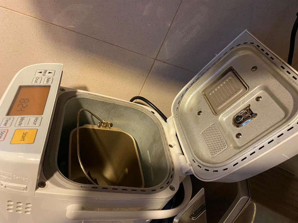 Panasonic bread maker (Category: Breadmakers) located in Singapore. Submitted by tanmayb (Listing ID 1105628484, Image 5). Description: In excellent condition. Was bought a few months ago and is rarely used. Can provide original warranty card, instructions booklet and recipe booklet (booklet has stains) ---- Automatically mixes, kneads, rises and bakes bread with a press of a button. The yeast dispenser automatically adds in the dry yeast at a pr