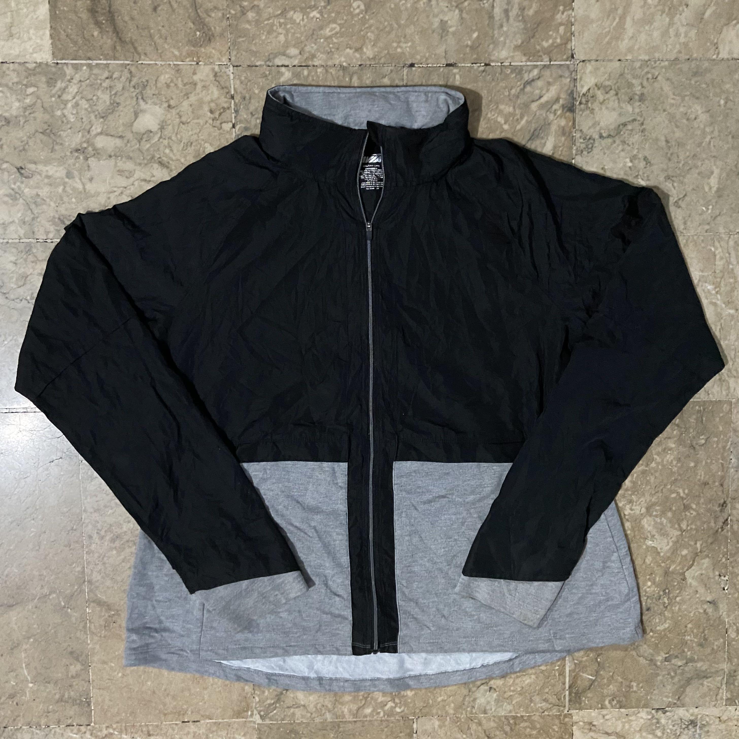 Women's Two-tone Jacket (Category: Activewear) located in Paranaque City. Submitted by _thebasement (Listing ID 1105645661, Image 1). Description: -with packable hood -needs washing -the black part is a windbreaker type material while the gray is cotton -XXL on tag but can only fit L (17 x 19.5).