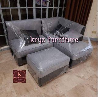 L-shape sofa w/ pillows and center table