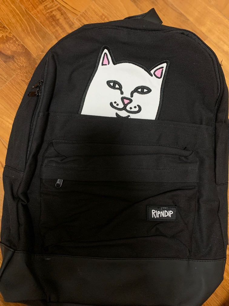 cat flipping off backpack