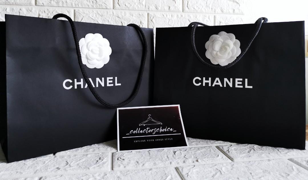 Auth CHANEL paperbag with camellia flower (Category: Luxury Bags & Wallets) located in Makati City. Submitted by _collectorschoice_ (Listing ID 1106010188, Image 3). Description: 1) CHANEL Paperbag with Camellia Flower °💯 Authentic ° Unused ° Height: 13 inches ° Width: 17 inches ° 2 pieces available ° Php 4,000 each 2) CHANEL Paperbag with Camellia Flower 💯 Authentic ° Unused ° Height: 9.5 inches ° Width: 12 inches ° 2 pieces available ° Php 2,