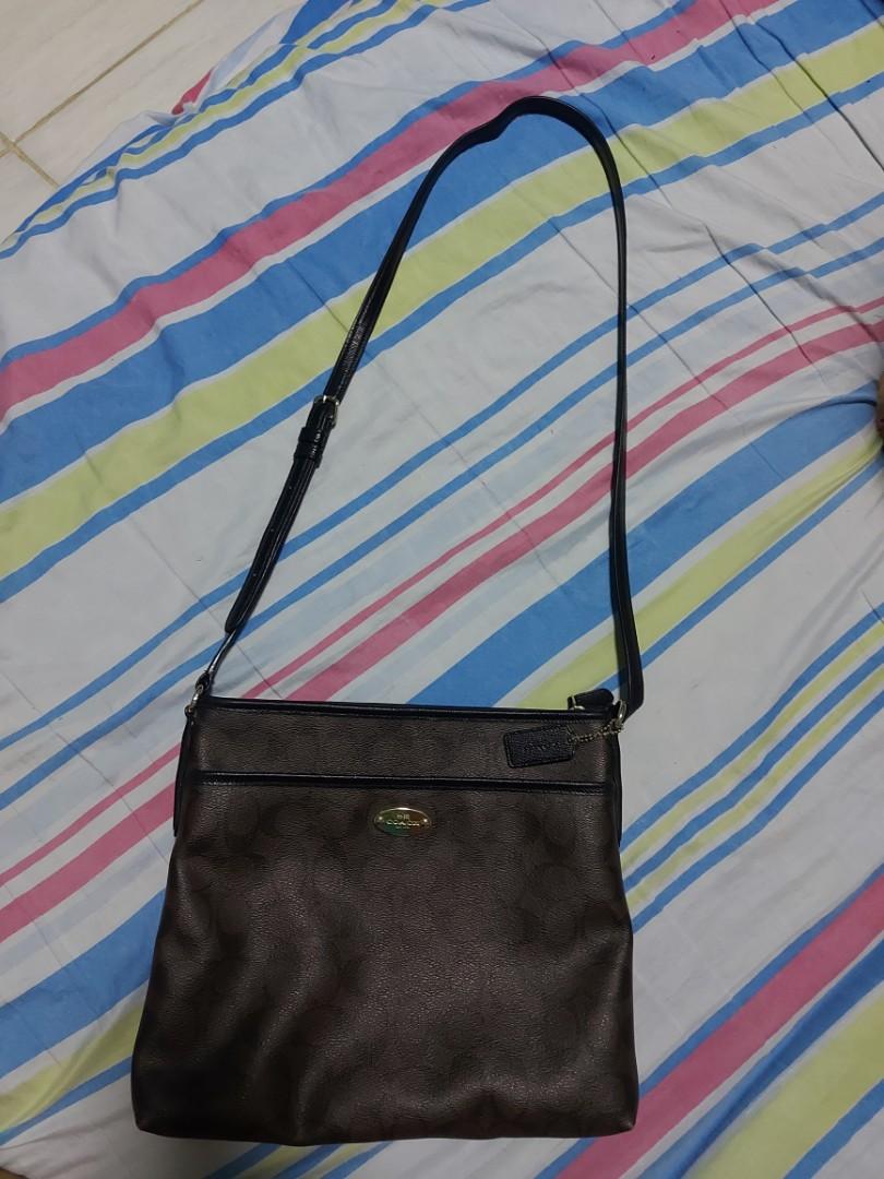 Authentic Coach Sling Bag (Category: Cross-body Bags) located in Calamba. Submitted by mel013 (Listing ID 1106122596, Image 1). Description: For sale authentic coach sling bag excellent used condition no flaws. few sign of usage.