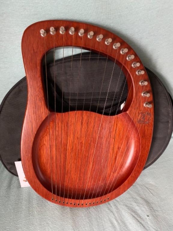 WALTER.t 16-String Wooden Lyre Harp (Category: Musical Instruments) located in Cavite. Submitted by rein0407 (Listing ID 1106022459, Image 3). Description: WALTER 16-string Wooden Lyre Harp The wooden lyre is a string instrument for its use Greek classical antiquity and later periods compact size and lightweight. 16 metal strings design, which can make melodious and bright sound while playing them with your fingers. Mahogany solid wood body with 