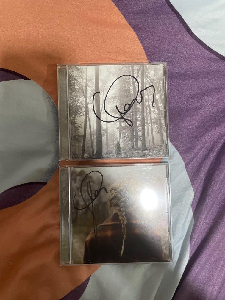 Taylor Swift signed evermore and folklore (Category: Western Merchandise) located in Taguig. Submitted by rep13 (Listing ID 1112868640, Image 1). Description: 3k for both.
