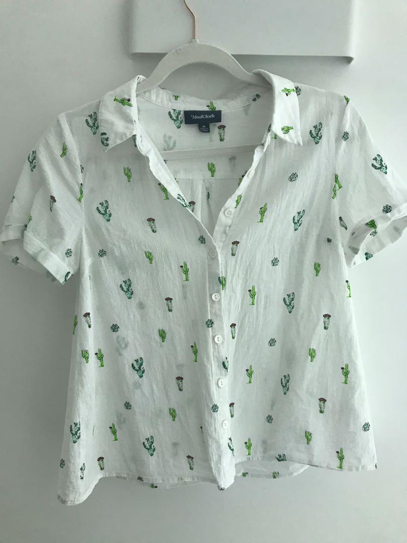 Cactus Button Down (Category: Shirts) located in Singapore. Submitted by jthie407 (Listing ID 1113354742, Image 1). Description: This cute little button down is from ModCloth, still in wearing condition..