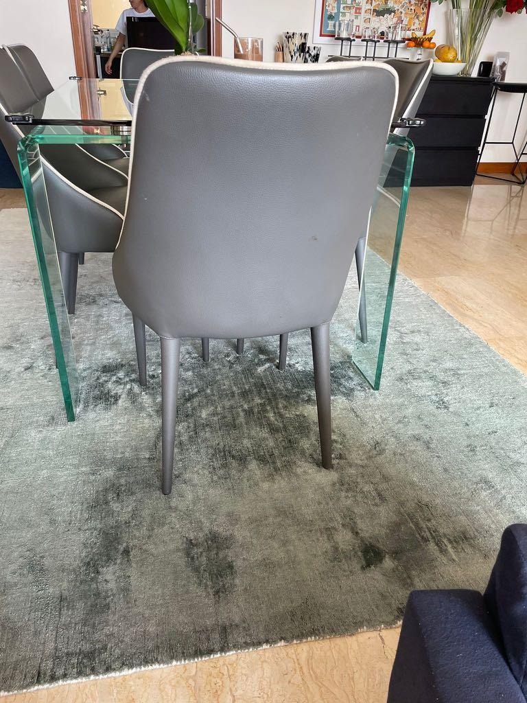 Dining Table (Category: Tables & Sets) located in Singapore. Submitted by suhaniw (Listing ID 1113462194, Image 3). Description: All glass 6 seater dining table size 36” x 72” x 30” ht - $250 | SOLD Chairs are grey faux leather with white piping Chairs available too $40 each Meet up.