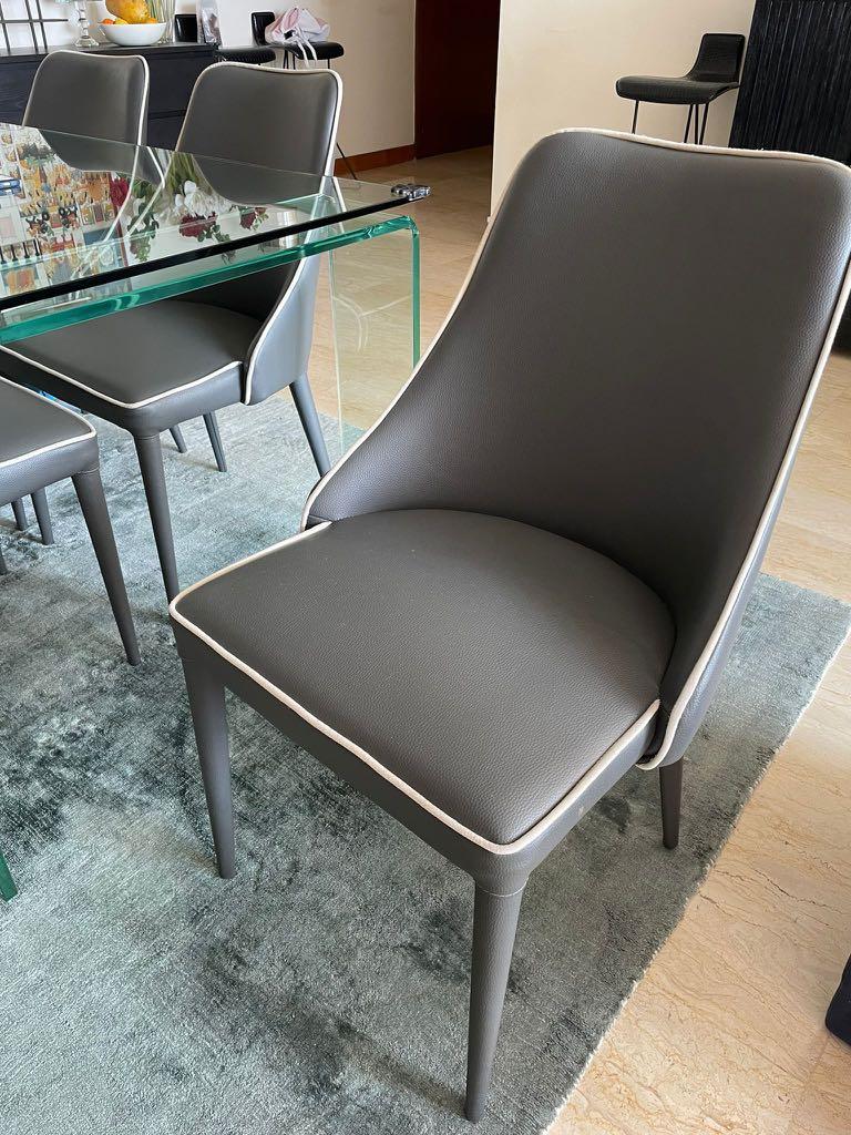 Dining Table (Category: Tables & Sets) located in Singapore. Submitted by suhaniw (Listing ID 1113462194, Image 2). Description: All glass 6 seater dining table size 36” x 72” x 30” ht - $250 | SOLD Chairs are grey faux leather with white piping Chairs available too $40 each Meet up.