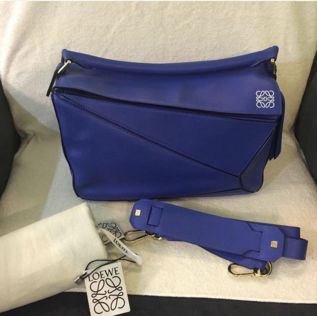 Loewe (Category: Luxury Bags & Wallets) located in Pasig City. Submitted by emashopaholic (Listing ID 1113478020, Image 3). Description: Brand new Loewe Puzzle bag Royal blue Small Comes with tags, strap, dust bag. No more paper bag The color is super nice. RFS: Gcash/BDO/BPi MoP: Gcash/BDO/BPi Dimensions: Strap length: 80.5 - 115.5 cm (adjustable). Handle drop: 7.0 cm. Weight : 0.5 kg. Height: 16.5 cm. Width: 24 cm. Depth: 10.5 cm. .