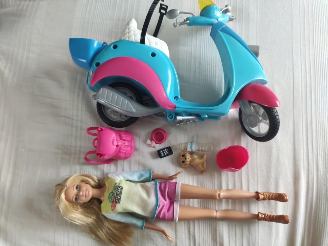Barbie pink passport travel doll with scooter store
