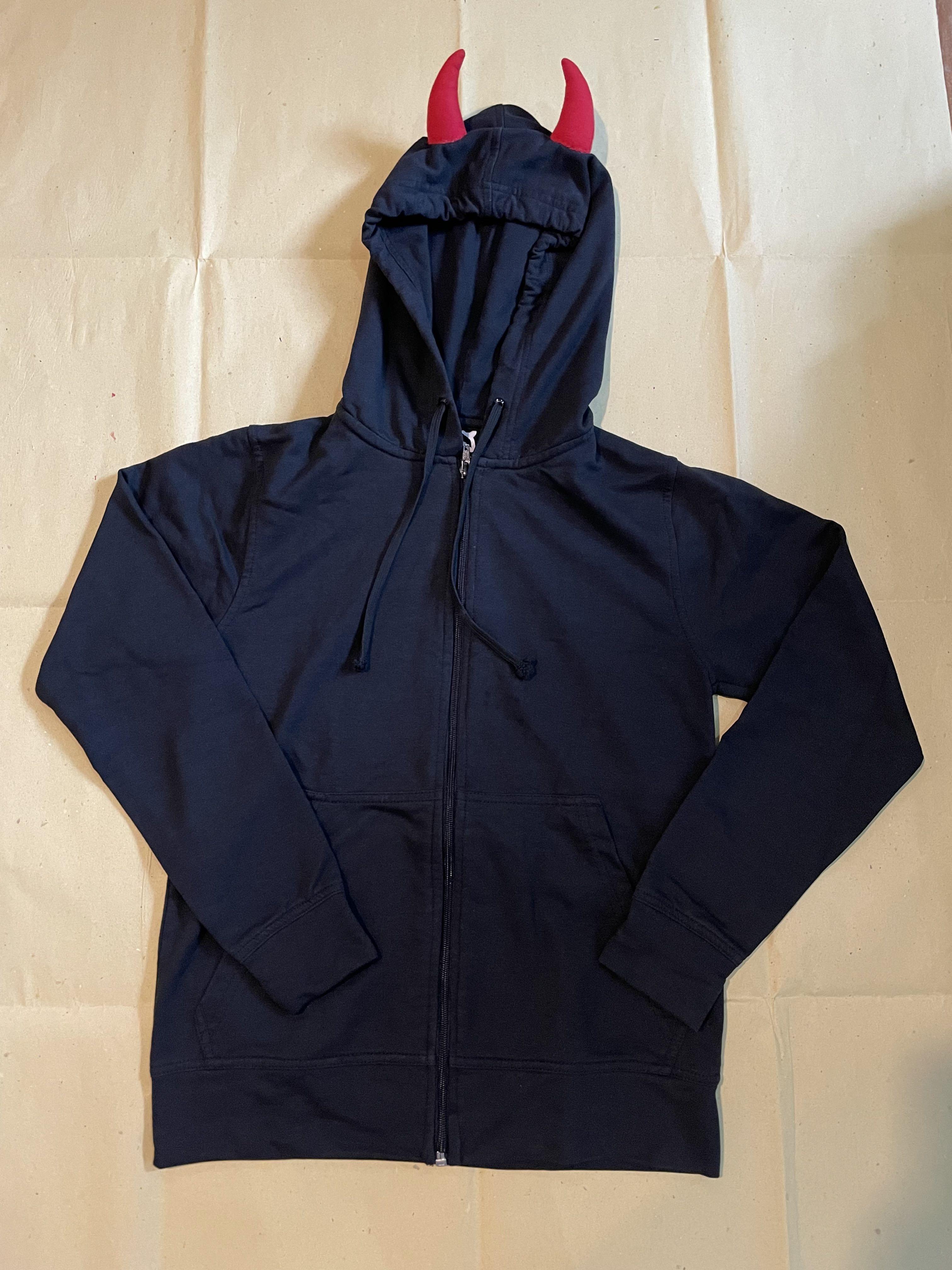 Black unisex hoodie with devil horns (Category: Coats, Jackets and Outerwear) located in Mandaluyong City. Submitted by mextran (Listing ID 1113823129, Image 1). Description: Black hoodie with devil horns - just in time for Halloween! Size: XXS (width 16 inches, length 22 inches) Unisex Hardly used Payment: BPI / Metrobank Shipping fee: shouldered by /o buyer through Fastrack, Gogo Express, Lalamove, Grab.
