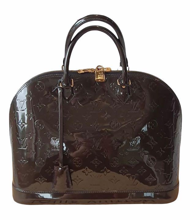 Louis Vuitton (Category: Luxury Bags & Wallets) located in Pasig City. Submitted by emashopaholic (Listing ID 1114056285, Image 1). Description: Preloved Authenticity guaranteed Louis Vuitton Alma MM Midnight blue Vernis Slightly used Comes with dustbag and lock set This is your chance to go twinning with Paris Hilton and Kim Kardashian! RFS: moving out sale. To prevent excess baggage. Lessening our luggages. .