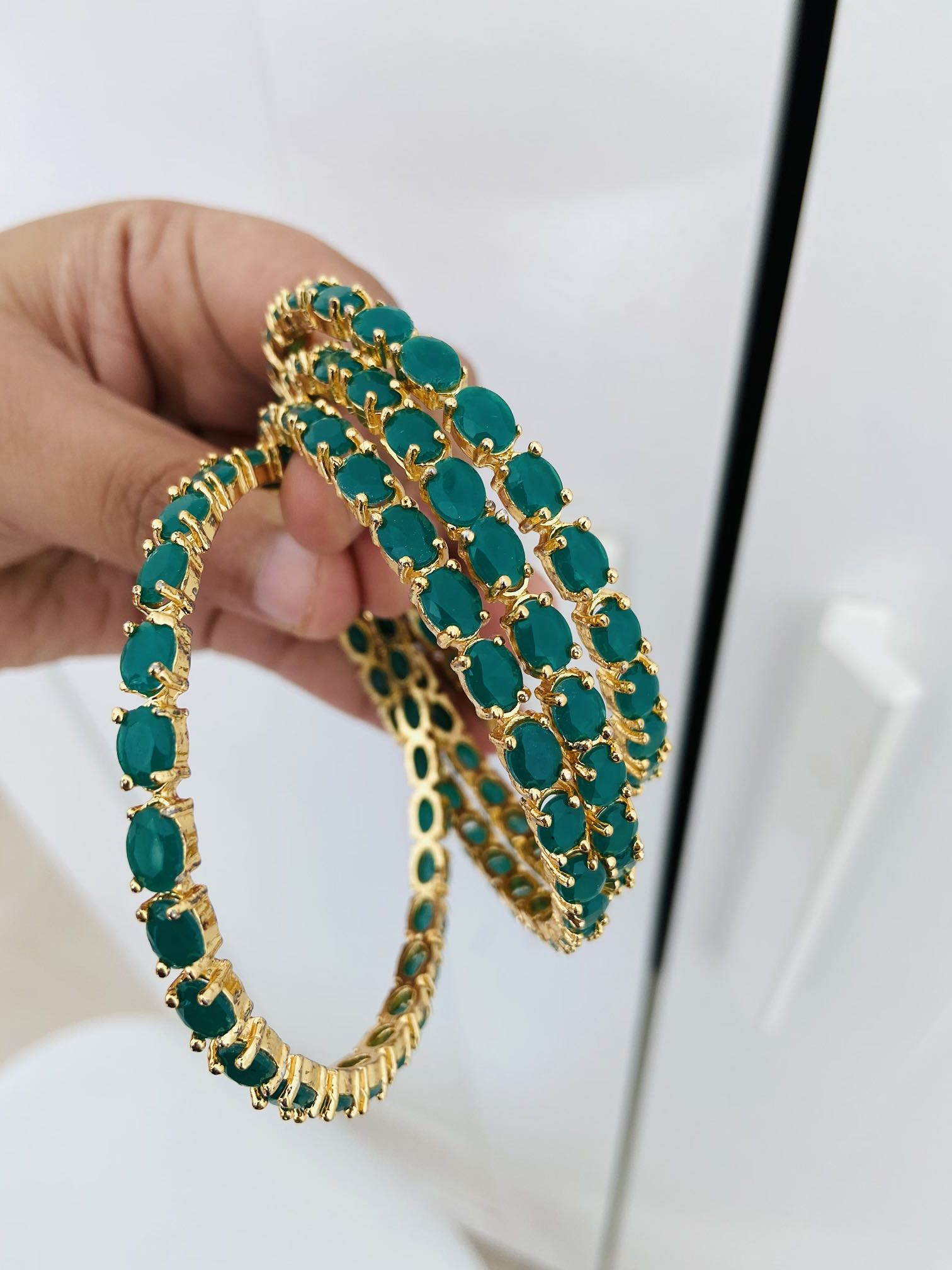 Gold top emerald bangles
