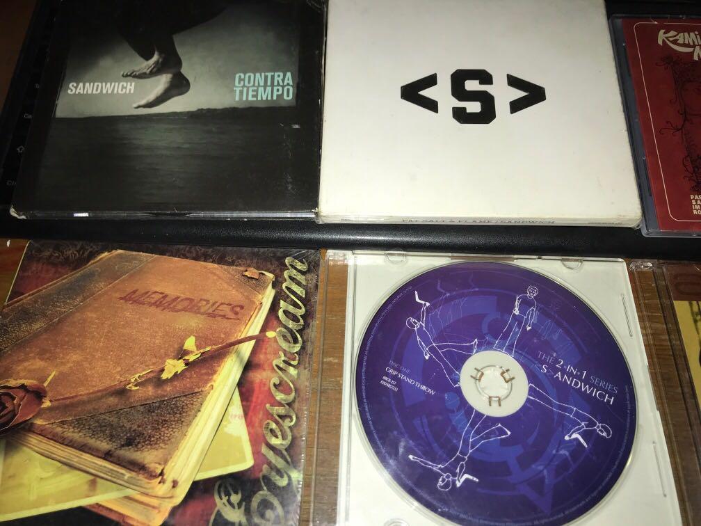 OPM CD set sale Sandwich etc (Category: CDs & DVDs) located in Cebu City. Submitted by zeo_99 (Listing ID 1114509585, Image 2). Description: 3 sandwich cds -850each- raimund marasigan band (eheads) (fat salt & flame never used) (comtra tiempo NM) (grip stand throw cd only VG) freebies pag lahatan binili: eyescream sealed new ascension (former rivermaya drums) like new kami napo sila cd (apo tribute feat parokya ni edgar kamikazee the dawn sandwic