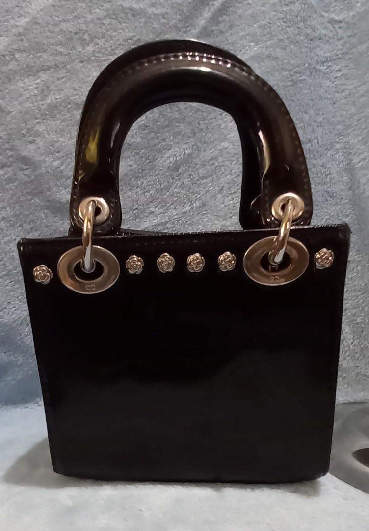 Christian Dior Inspo Mini Party Bag (Category: Luxury Bags & Wallets) located in Cainta. Submitted by zen_it_all (Listing ID 1114632530, Image 2). Description: CD Inspo handbag no strap slightly crooked bag posture with 2 small pull threads on the side plus sf.