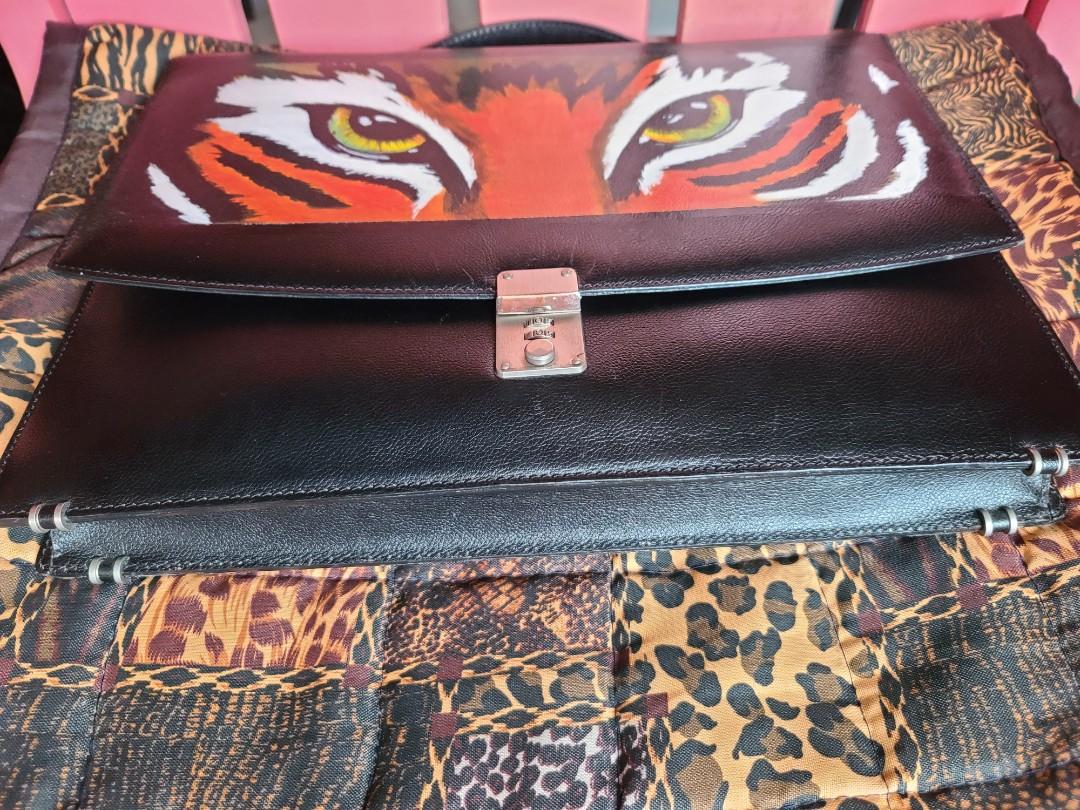 Off Brand Document/Laptop Bag (Category: Luxury Bags & Wallets) located in Manila. Submitted by shoppingspree008 (Listing ID 1114615592, Image 2). Description: This is a preloved off brand all leather document/laptop Bag.This is a work of art and hard to find.You won't see any Bag similar to this because of it's handpainted tiger accent :) super nice inner lining,lock system is working and this have feet ♡.