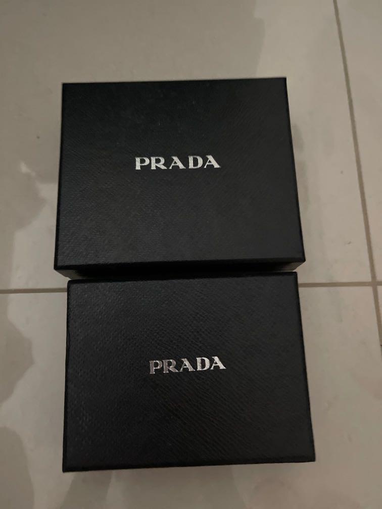 Prada empty box (Category: Accessories) located in Singapore. Submitted by ferferleo (Listing ID 1114575744, Image 1). Description: Small box $5 Big box $8 Big box 12cm (W) by 14cm (L) by 4.5cm (H) Sold Small box 9.5cm (W) by 10cm (L) by 4cm (H).