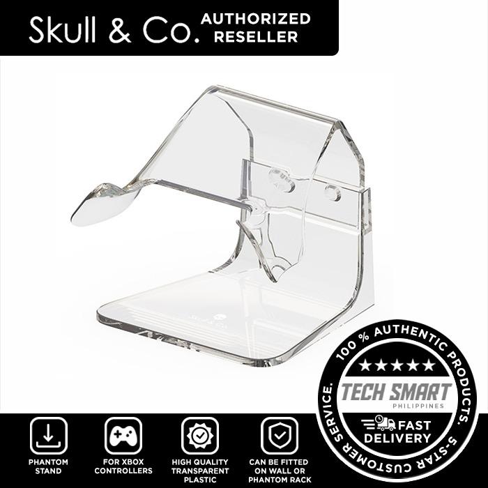 Skull & Co Phantom Stand Controller Stand for All Controllers (Category: Controllers) located in Manila. Submitted by techsmartph (Listing ID 1103955069, Image 3). Description: * Minimum presence, Maximum showcase - made of transparent plastic which best displays your controllers * Cut-out for the headphone jack - no need to unplug headphone when putting controller onto the Phantom Stand * Modular design - can be fitted to the wall or the Phantom
