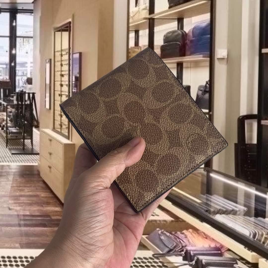 COACH®  Bifold Wallet In Signature Canvas