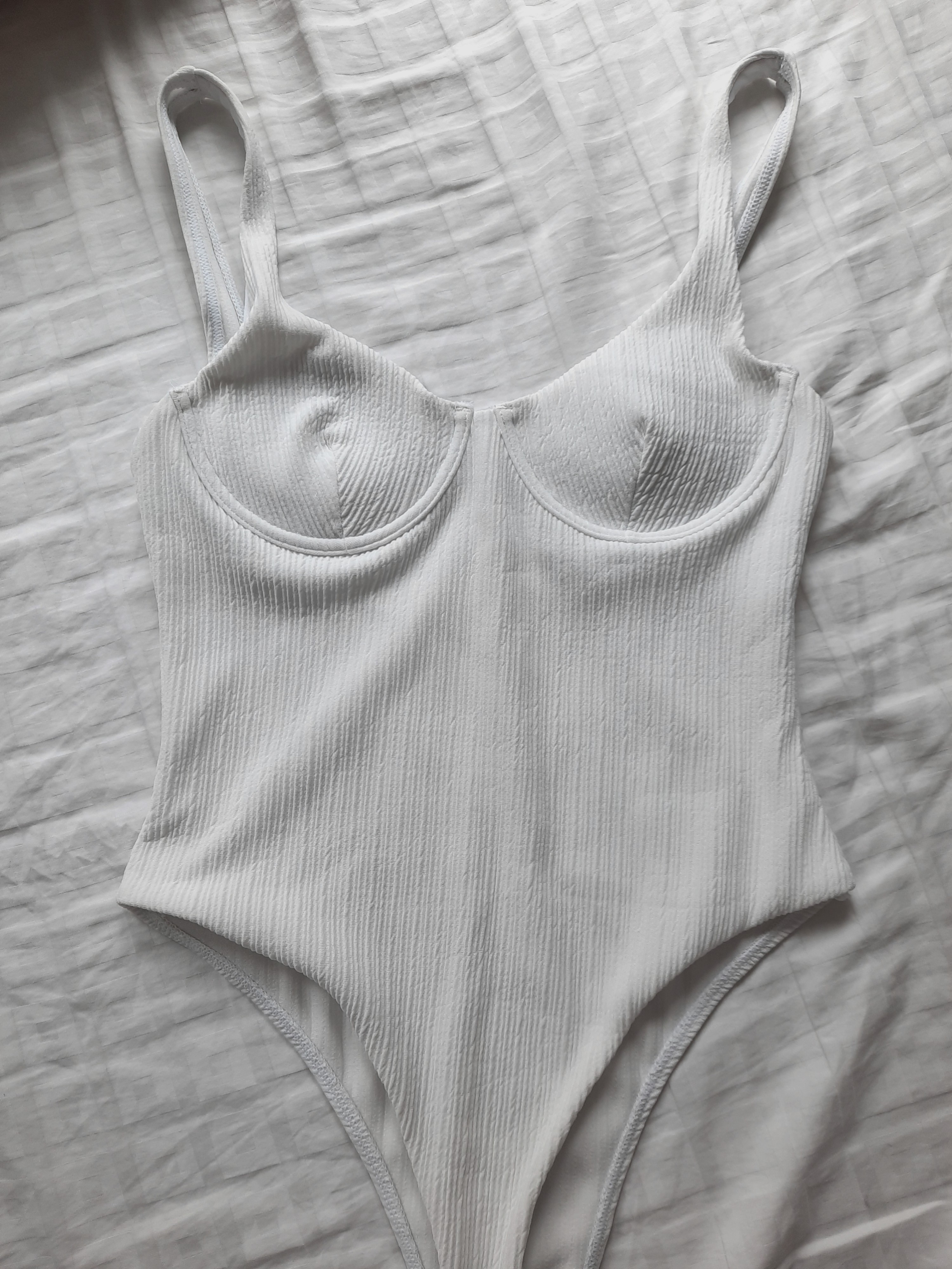 White Textured Bustier One Piece Swimsuit Monokini Women S Fashion Swimwear Bikinis Swimsuits On Carousell