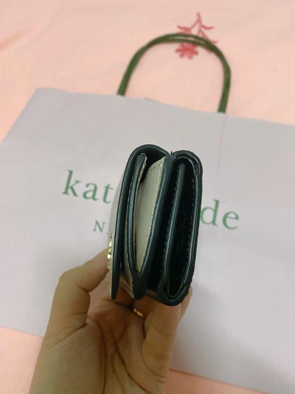 Authentic Kate Spade Micro Wallet (Category: Luxury Bags & Wallets) located in Quezon City. Submitted by anneprelovess (Listing ID 1114741874, Image 3). Description: Used only twice! Authentic Kate Spade Wallet with Paper Bag Good as new! Perfect small wallet that will fit all your cards, cash and coins! - 2.6"h x 4.2"w x 1.5"d - foil embossed logo - two way spade jacquard lining - snap closure - 3 card slots - bill fold - exterior snap coin comp