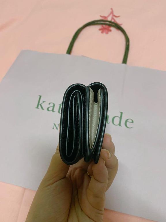 Authentic Kate Spade Micro Wallet (Category: Luxury Bags & Wallets) located in Quezon City. Submitted by anneprelovess (Listing ID 1114741874, Image 2). Description: Used only twice! Authentic Kate Spade Wallet with Paper Bag Good as new! Perfect small wallet that will fit all your cards, cash and coins! - 2.6"h x 4.2"w x 1.5"d - foil embossed logo - two way spade jacquard lining - snap closure - 3 card slots - bill fold - exterior snap coin comp