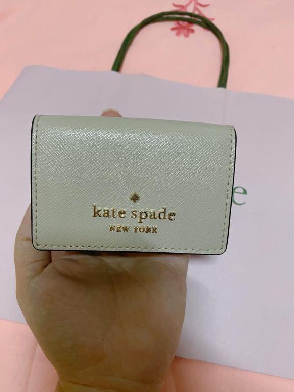 Authentic Kate Spade Micro Wallet (Category: Luxury Bags & Wallets) located in Quezon City. Submitted by anneprelovess (Listing ID 1114741874, Image 1). Description: Used only twice! Authentic Kate Spade Wallet with Paper Bag Good as new! Perfect small wallet that will fit all your cards, cash and coins! - 2.6"h x 4.2"w x 1.5"d - foil embossed logo - two way spade jacquard lining - snap closure - 3 card slots - bill fold - exterior snap coin comp