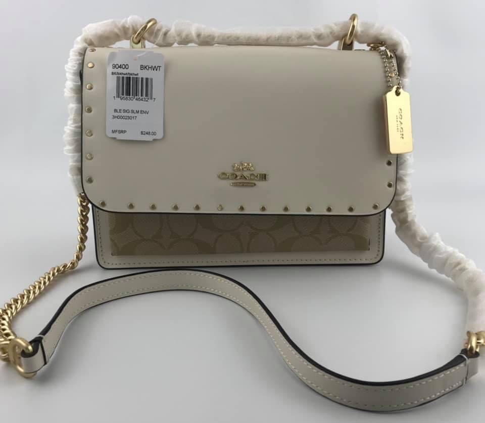klare crossbody in signature canvas with rivets