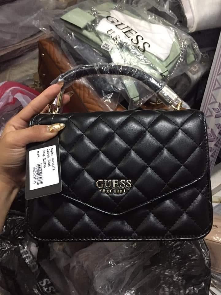 GUESS QUILTED HAND SLING BAG