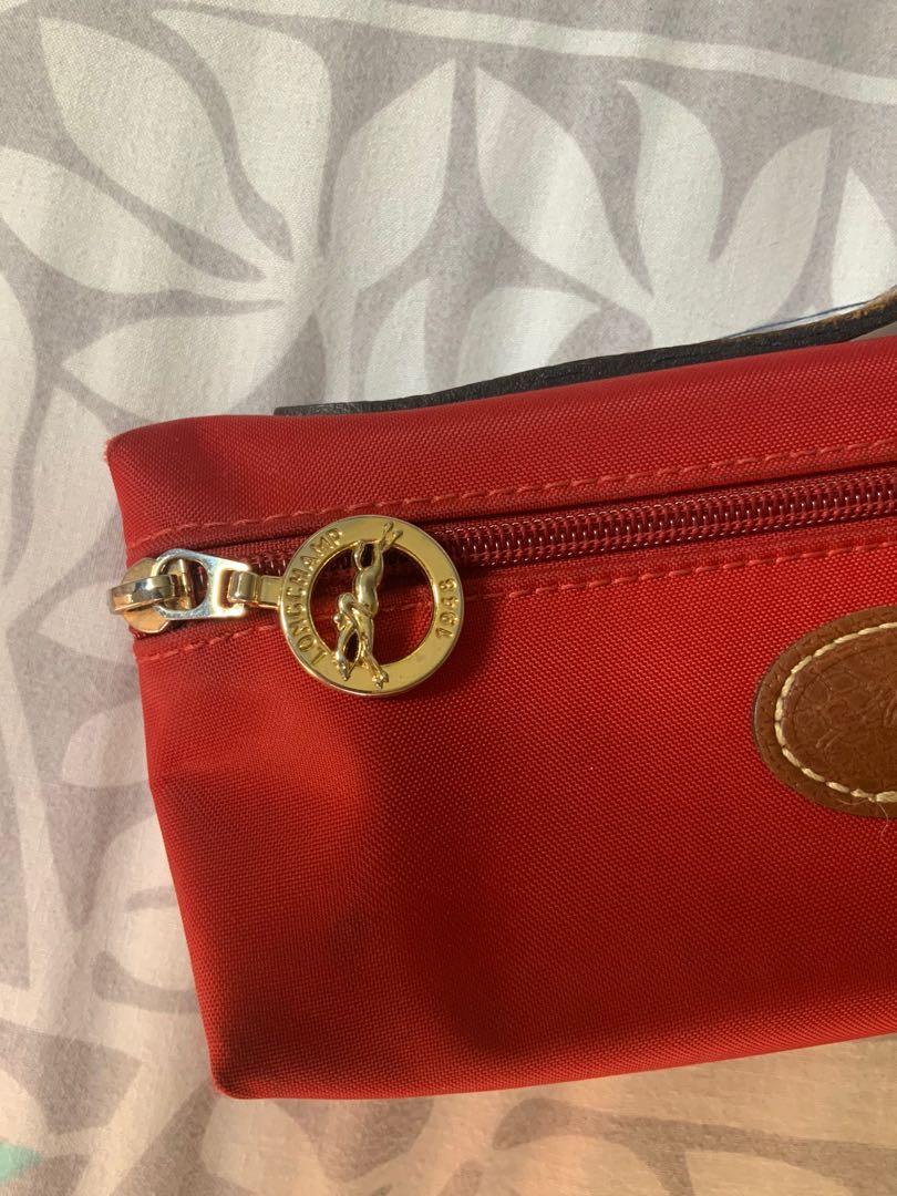 Longchamp Pouch (Category: Luxury Bags & Wallets) located in Paranaque City. Submitted by malawari (Listing ID 1114984609, Image 2). Description: Longchamp pouch Authentic Check signs of usage in pics .