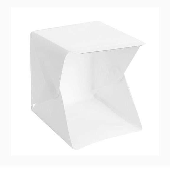 Portable Lightbox (Category: Lighting & Studio Equipment) located in Rizal. Submitted by casaramirez (Listing ID 1115021332, Image 1). Description: Portable Lightbox for photography of small items and products. Set includes: -Folding Lightbox w/ LED Lights -2 Backdrops (White & Black) -Storage Bag -Micro USB Cable Dimensions: 20 x 23 x 23 cm Other Details: Can be plugged to a powerbank to light up the LED lights..