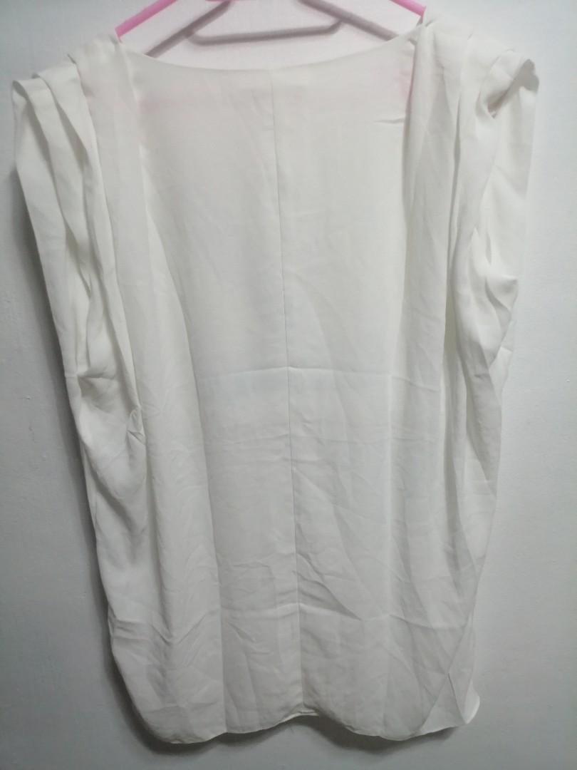 Helmut lang (Category: Dresses) located in Makati City. Submitted by bimmeup (Listing ID 1115214605, Image 1). Description: White large blouse 1500 + sf No issues.