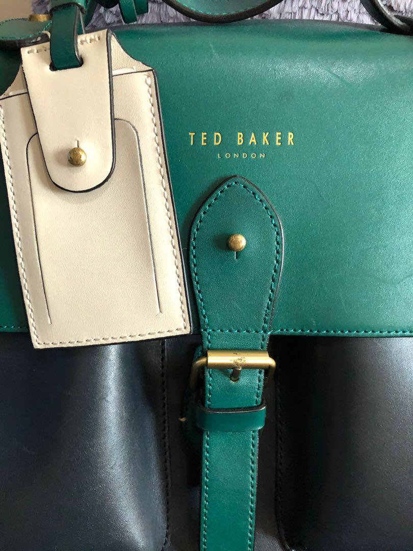 Ted Baker Satchel Bag (Category: Luxury Bags & Wallets) located in Mandaluyong City. Submitted by thestoreph (Listing ID 1115170860, Image 2). Description: Original. Pristine condition. Like new. With strap, bag tag and dust bag. Payment via GCash or BPI. Payment before shipment. Meet up. Strictly in SM Light only ( beside BONI Mrt Station) Can ship. Lalamove/Grab/LBC Buyer shoulders shipping fee Posted price is last price Posted until sold.