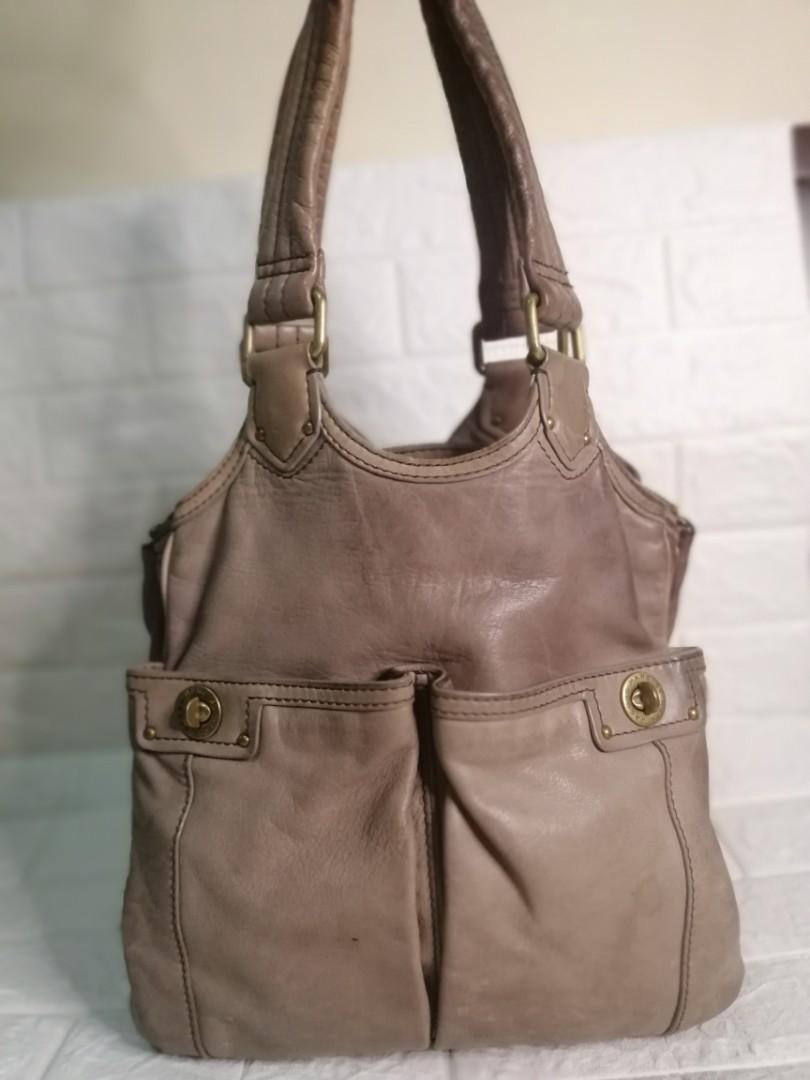 Marc Jacobs Totally Turnlock Teri Tote Bag (Category: Luxury Bags & Wallets) located in Las Pinas. Submitted by etoksi1234 (Listing ID 1115318811, Image 1). Description: Pre-loved Marc Jacobs Totally Turnlock Teri Tote bag... Medium to Semi Large size bag... Brass hardware... Minimal signs of usage... Last pic for reference only... Please manage your expectations. All sales are final. Kindly examine pictures carefully when buying online. No retur