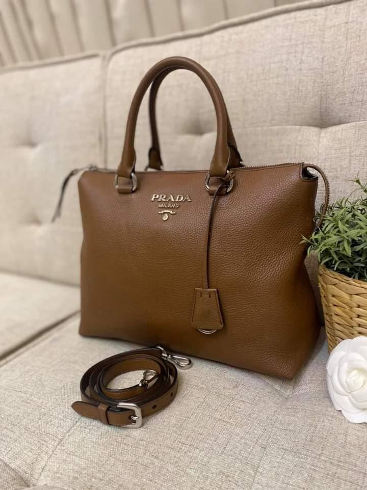 Prada Vitello Phenix 2-way bag (Category: Luxury Bags & Wallets) located in Manila. Submitted by bagislifeshop (Listing ID 1115440206, Image 3). Description: Prada Babyyyy!!! 🤎🤎🤎 On Hand in PH🇵🇭 100% Authentic Prada Vitello Phenix 2-Way Bag in Brown Condition: 9/10 Comes with Standard Dustbag and Strap.